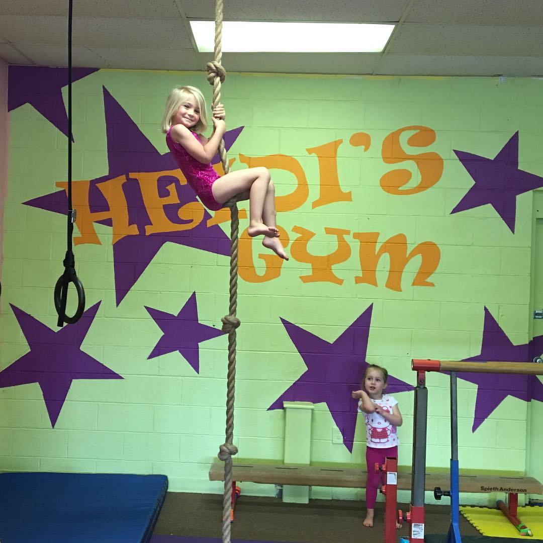 gymnast climbing rope